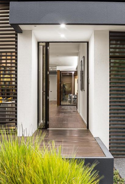 modern-house-exterior-with-open-door-and-deck-2026-03-09-03-26-52-utc