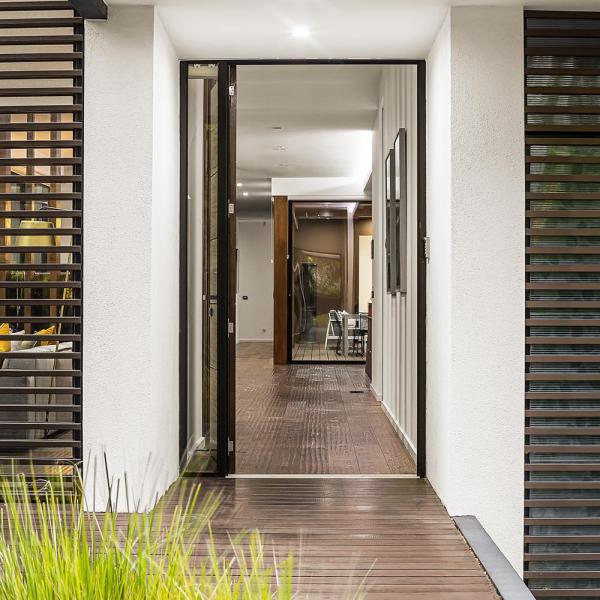 modern-house-exterior-with-open-door-and-deck-2026-03-09-03-26-52-utc
